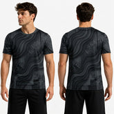 Black patterned t-shirt worn by a model on a white background