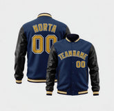 Navy blue varsity jacket with black leather sleeves and gold lettering on a white background