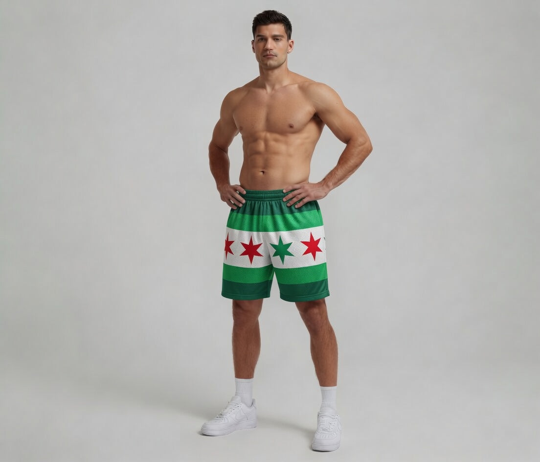 Man wearing green shorts with red star patterns on a plain background
