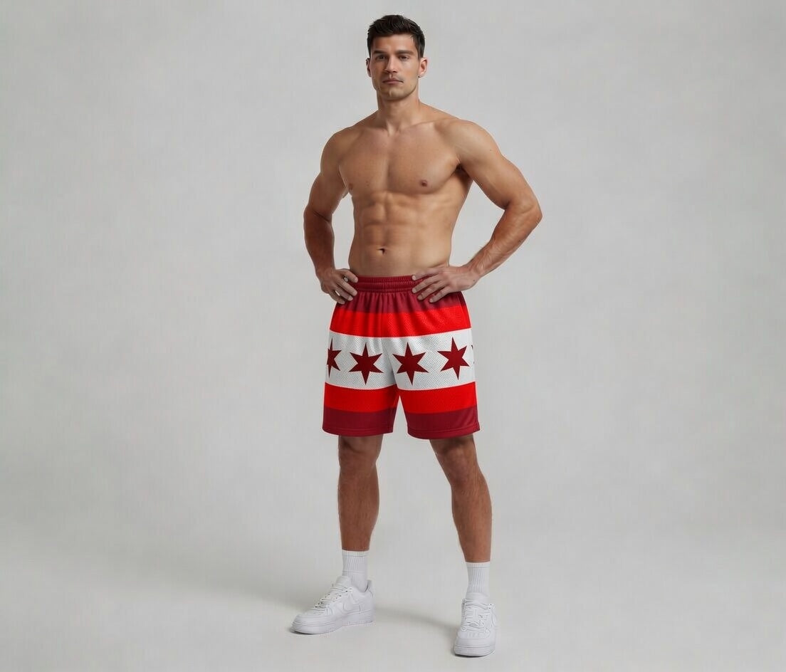 Man wearing red and white shorts with star pattern on a plain background