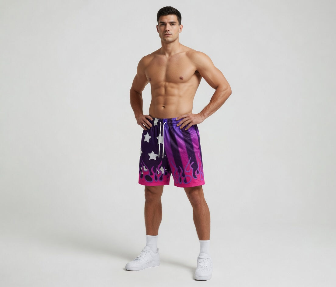 Man wearing a colorful American flag-themed shorts on a white background