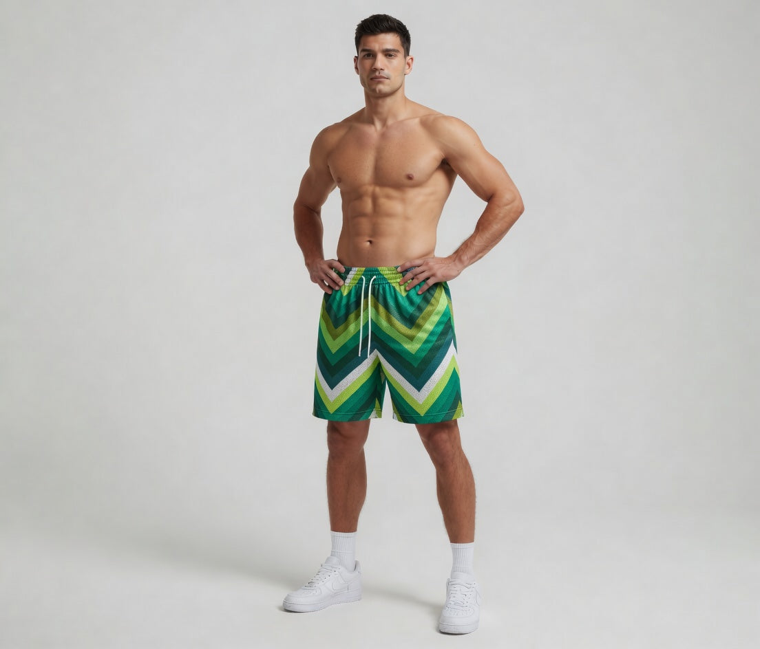 Man wearing green and white striped swim shorts on a plain background