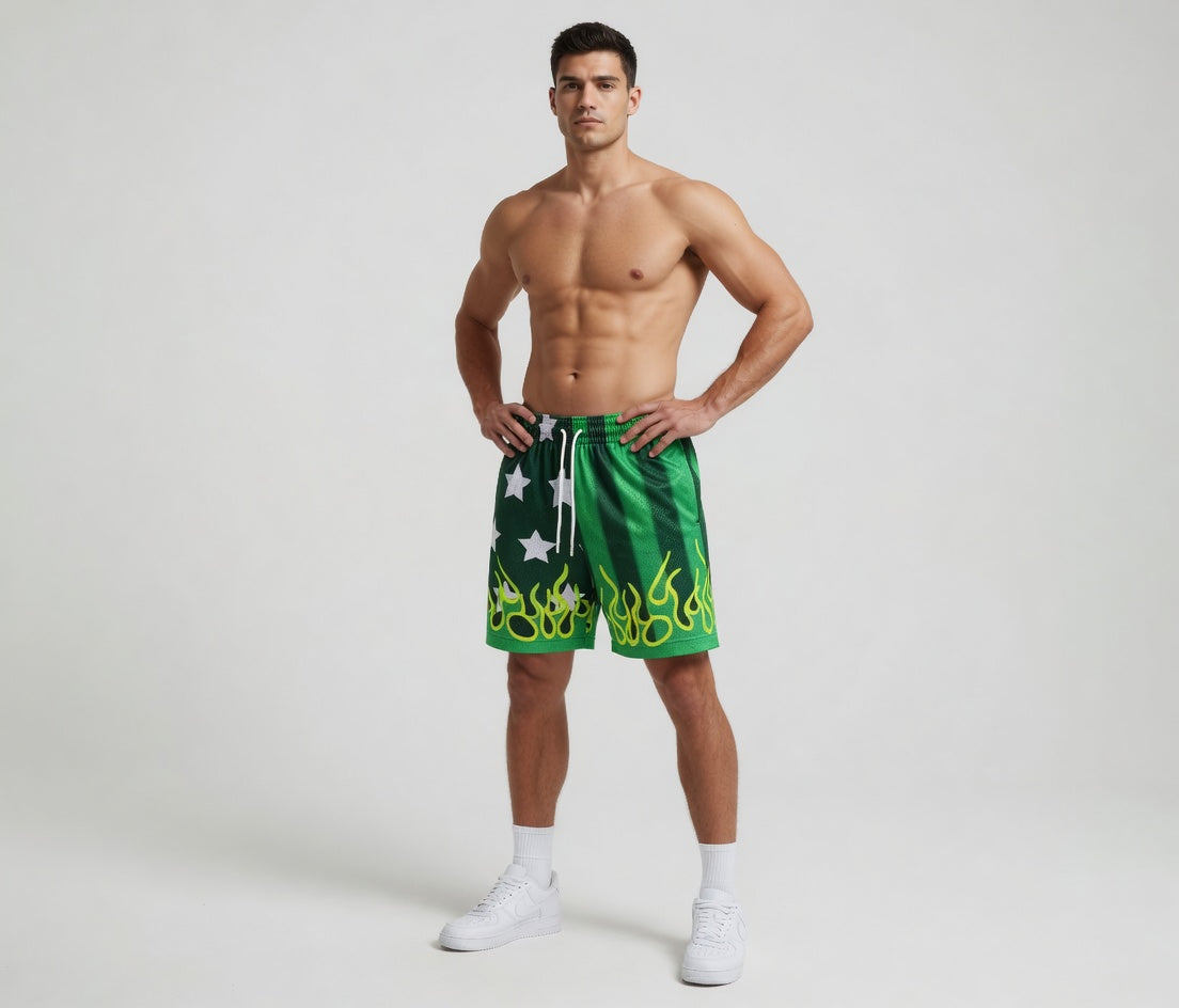 Man wearing green swim shorts with white star design on a plain background