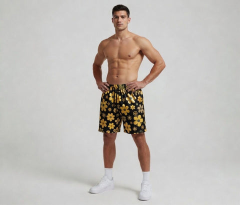 Man wearing black shorts with yellow floral patterns on a white background