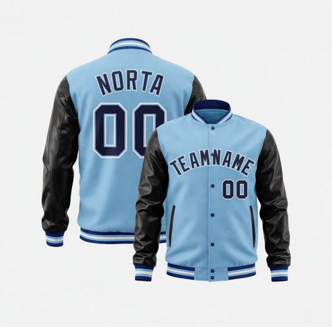 Light blue varsity jacket with black leather sleeves on a white background