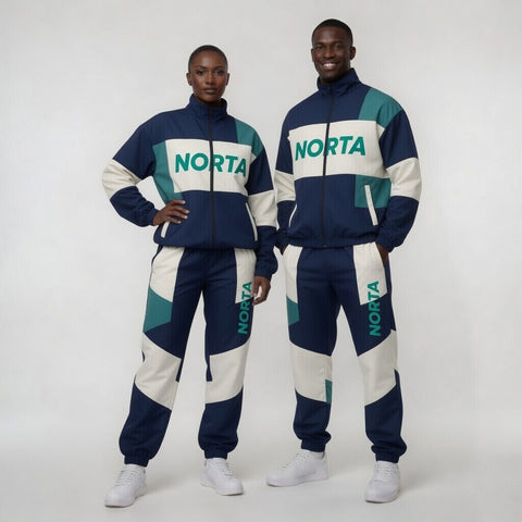 Two people wearing matching tracksuits with 'Norta' branding on a white background