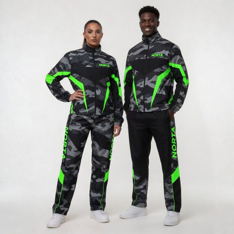 Two people wearing matching camouflage tracksuits with green accents on a white background